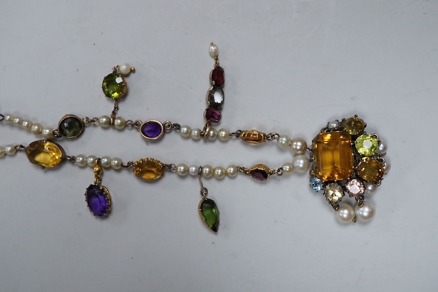 An Arts & Crafts gem-set and pearl necklace, circa 1900, composite, set with variously cut stones including citrine, amethyst, peridot, tourmaline and zircon, and pearls, length 42cm, pearls untested, Condition: good, ty